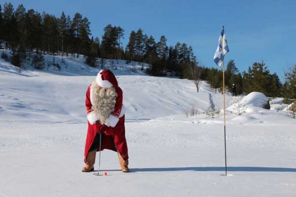 Santa Claus golfing in snow