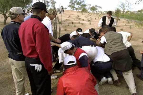 Tiger Woods watches fan move a boulder at the 1999 Waste Management Phoenix Open